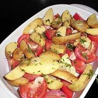 Geschmorte Schweinekoteletts mit Tomaten